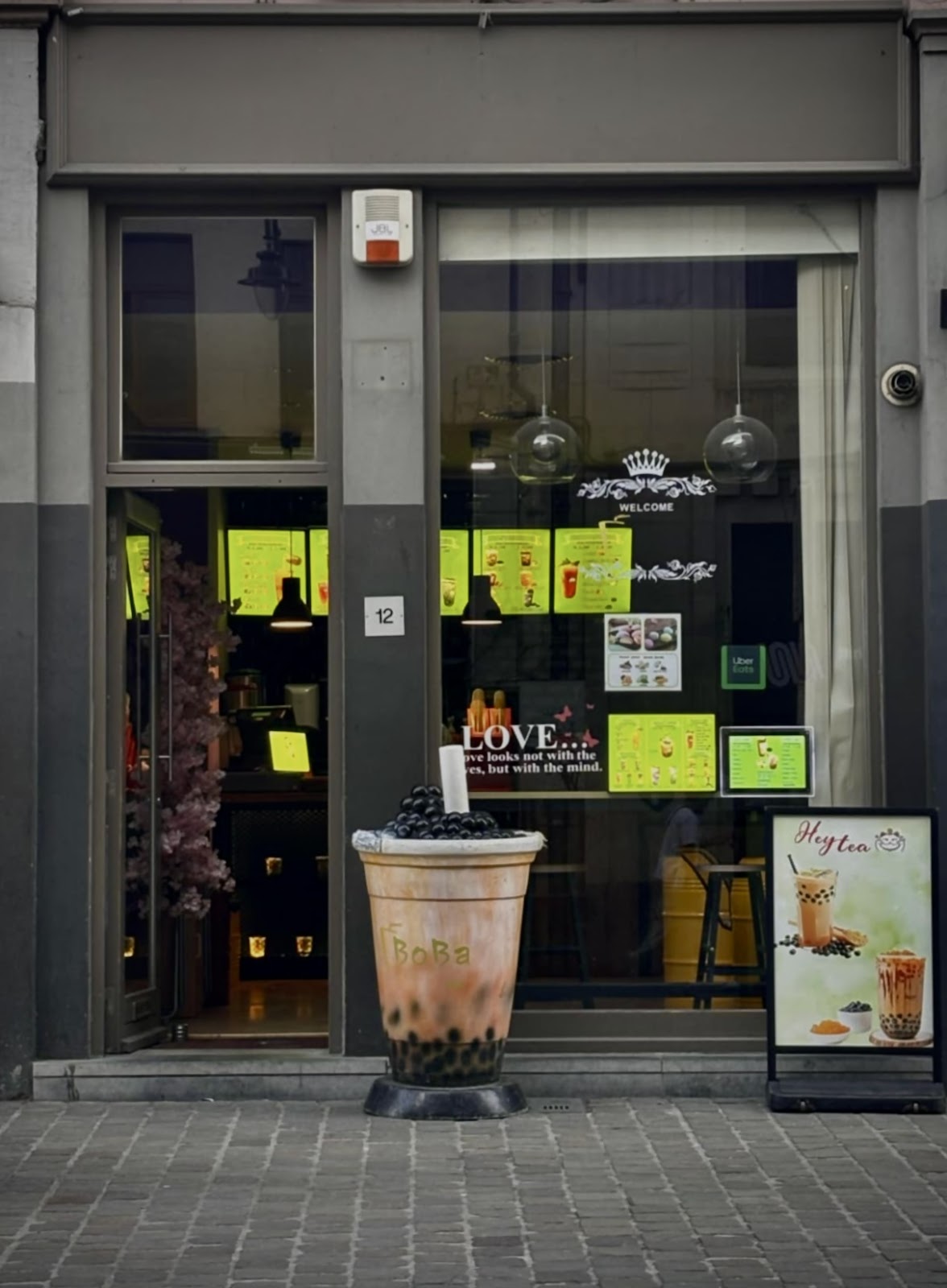 Heytea storefront on Visverkopersstraat 12 in Brussels with a giant boba cup outside